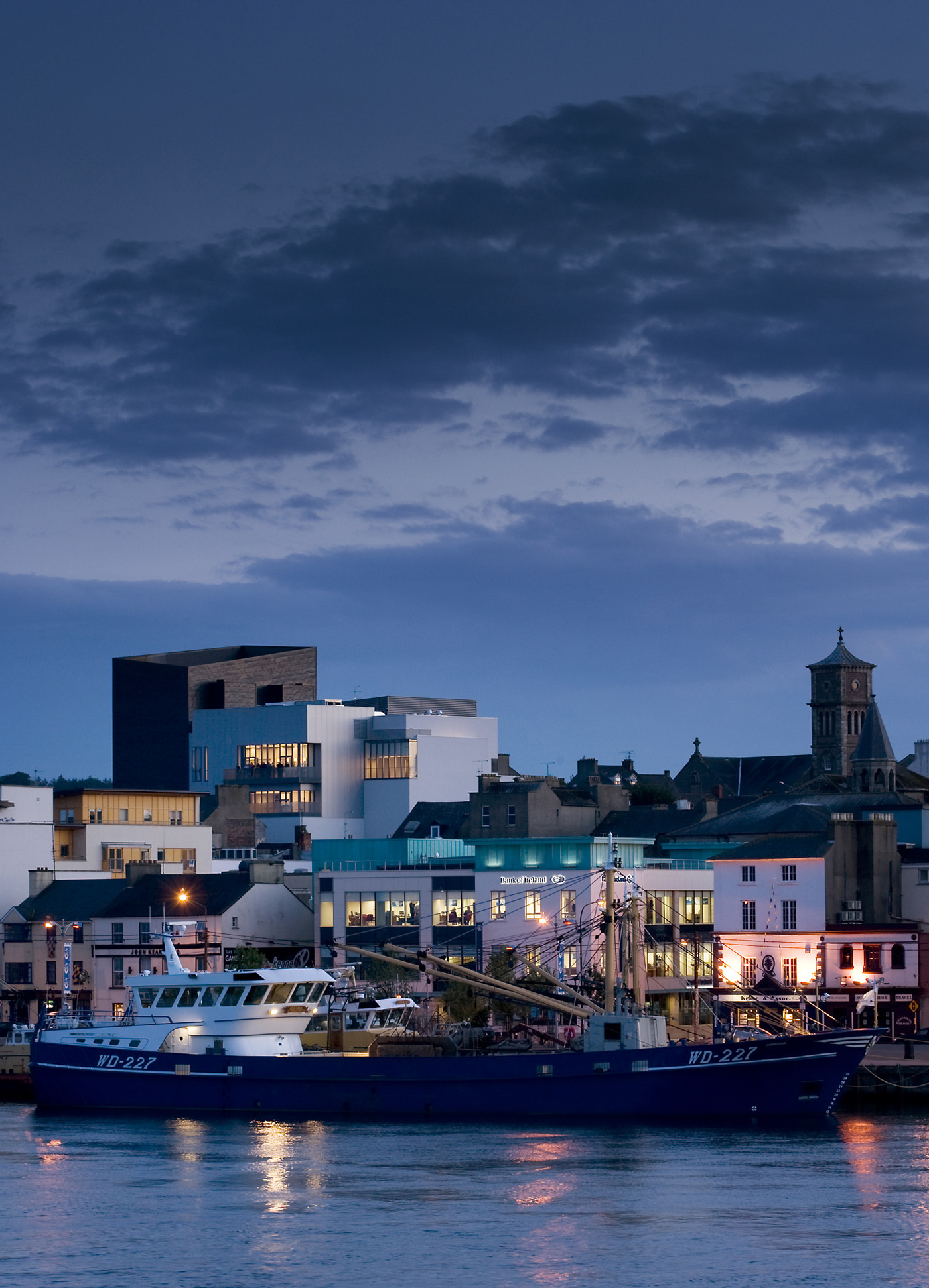 Night view of the National Opera House and waterfront viewed from across the River Slaney, Wexford Ireland. One of the great small opera houses of the world.